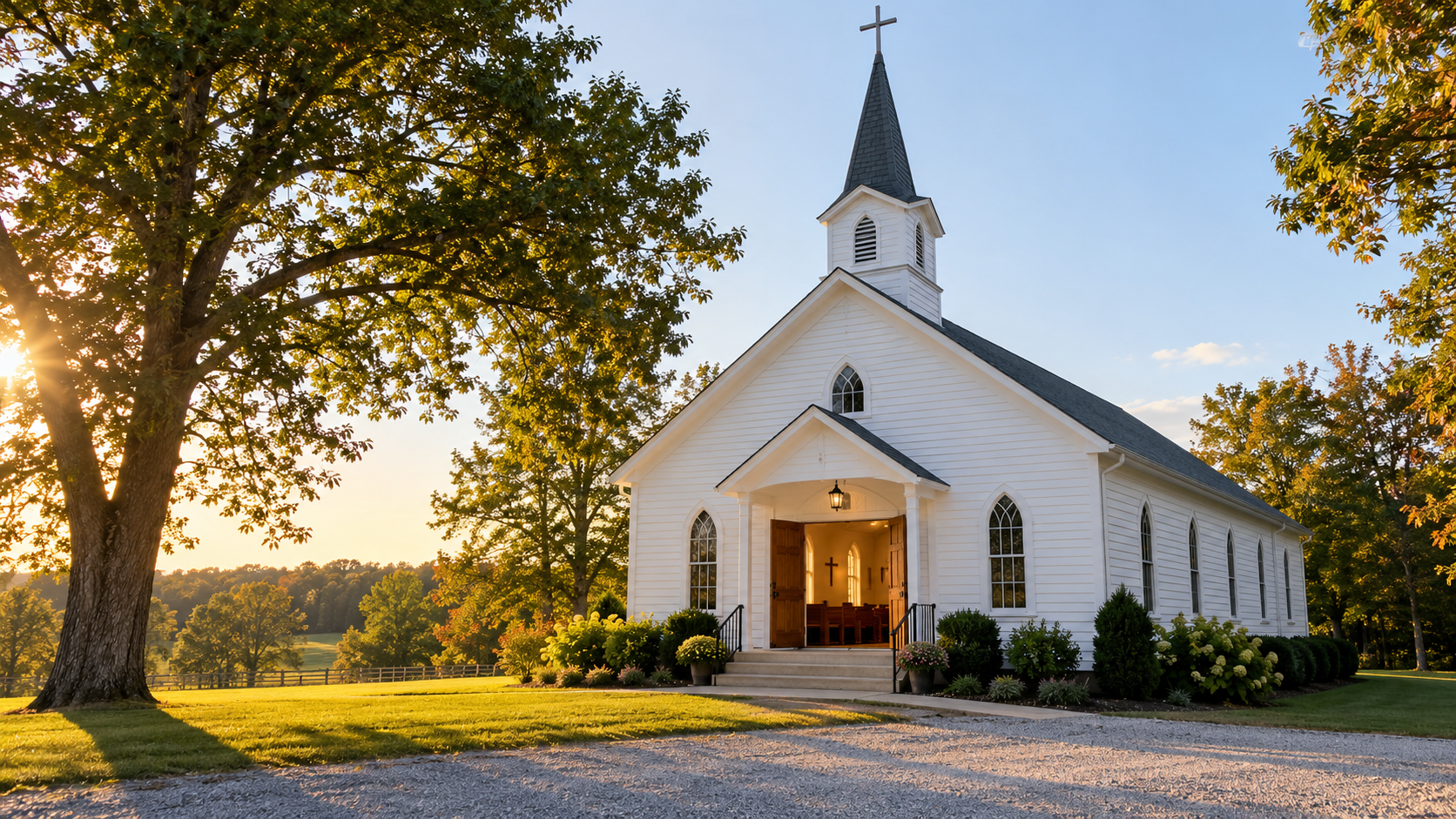 A small white country church in warm morning light