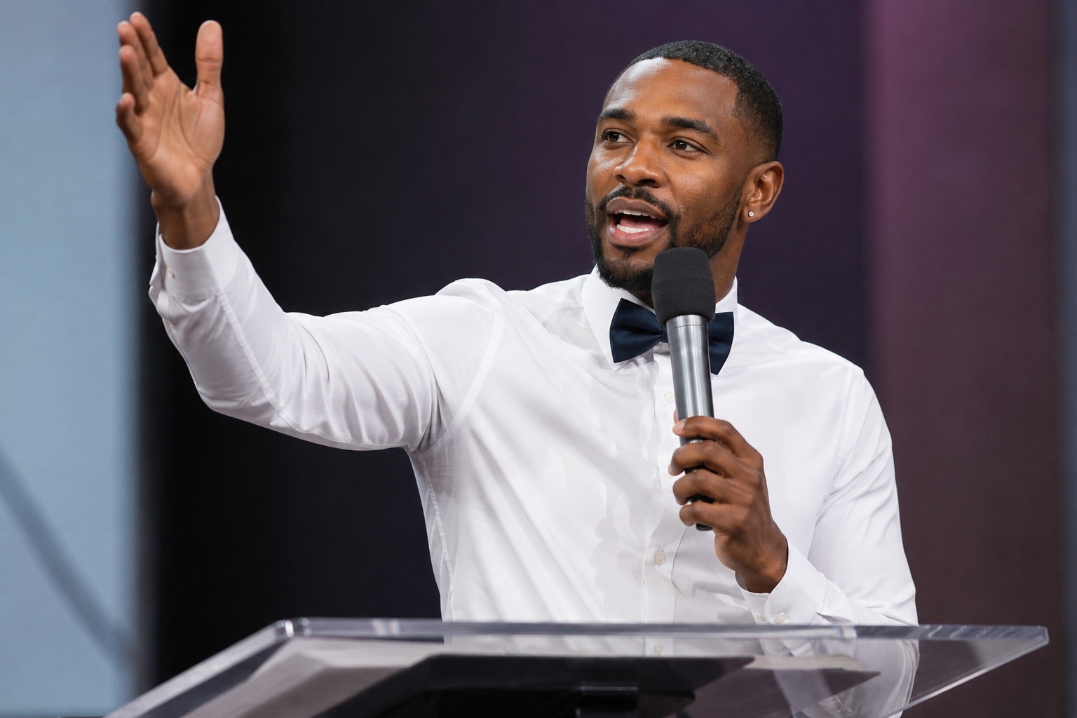 Joseph Young preaching with a microphone